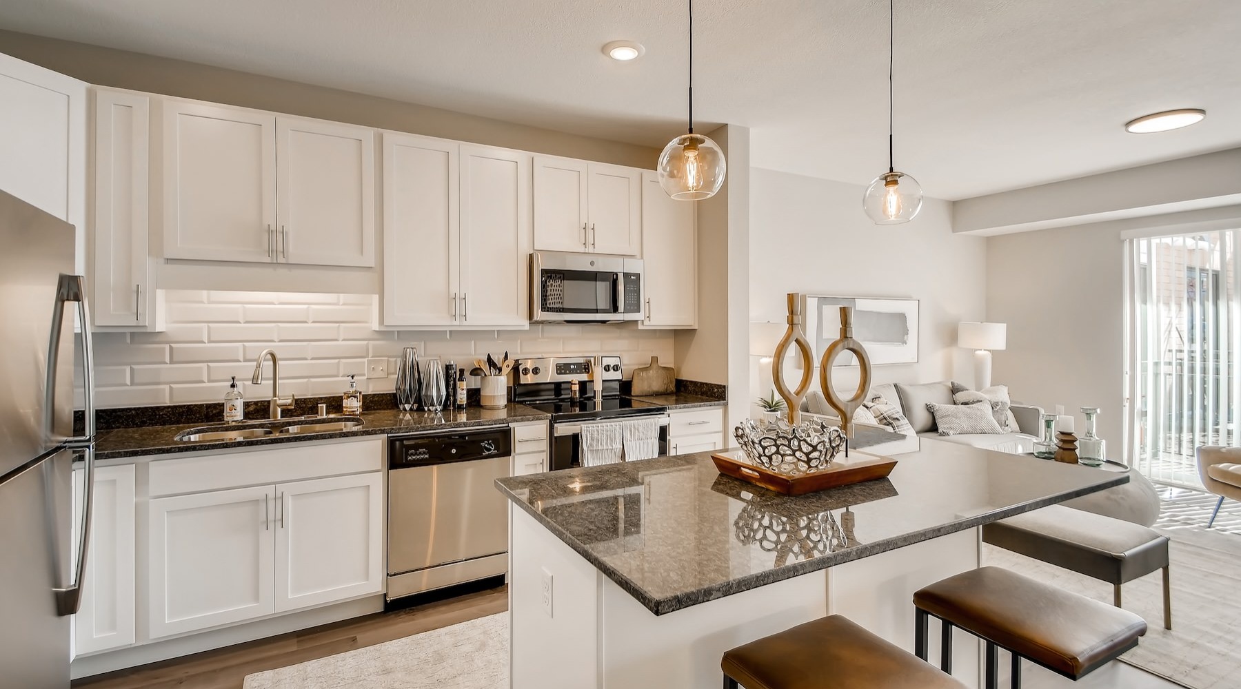 a kitchen with white cabinets