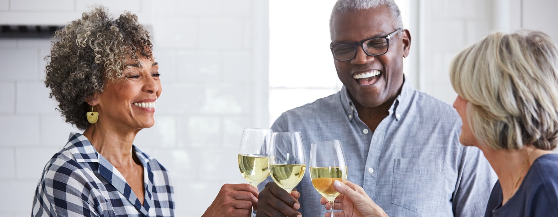a few people toasting wine glasses
