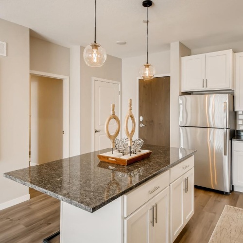 a kitchen with white cabinets