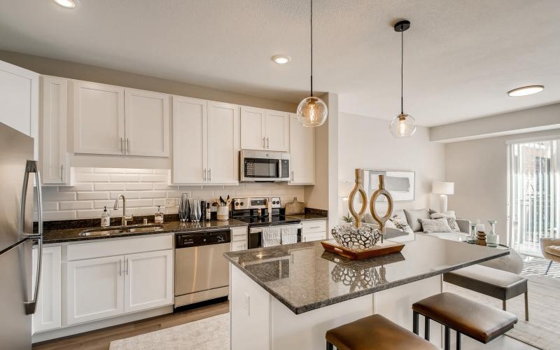 a kitchen with white cabinets