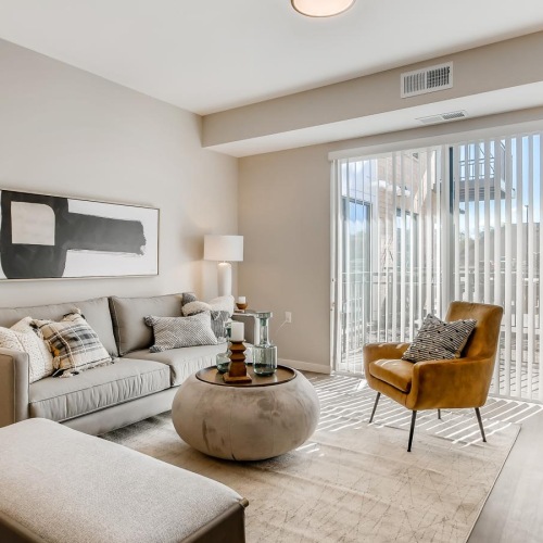 a living room with a couch and a chair