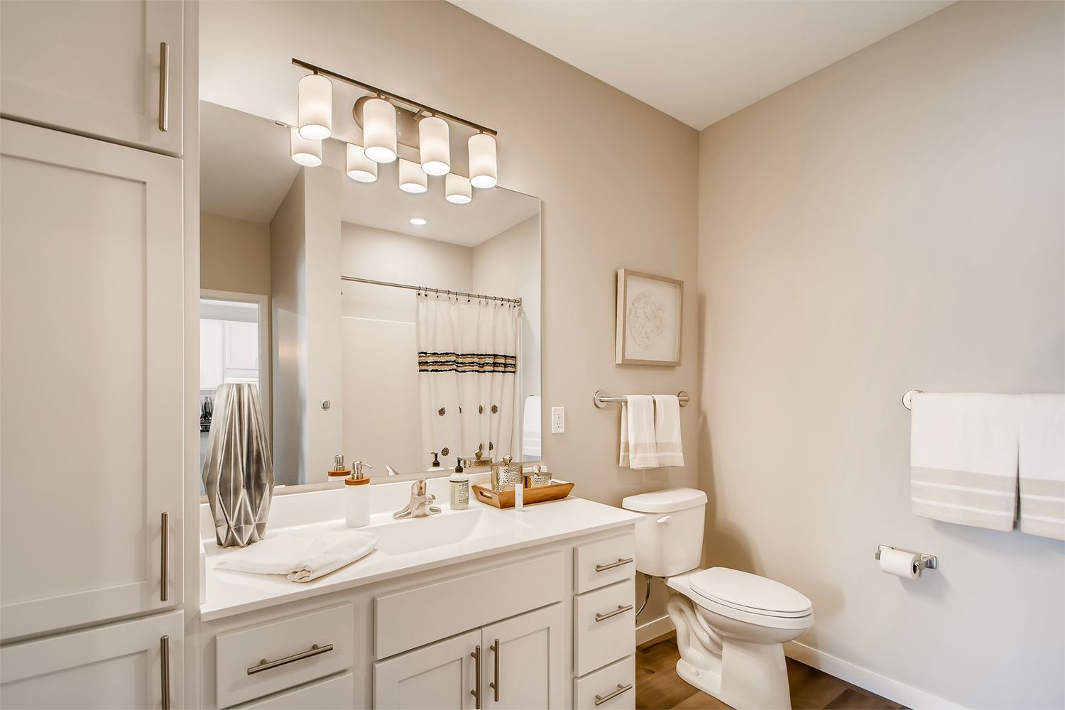Bathroom with white cabinets